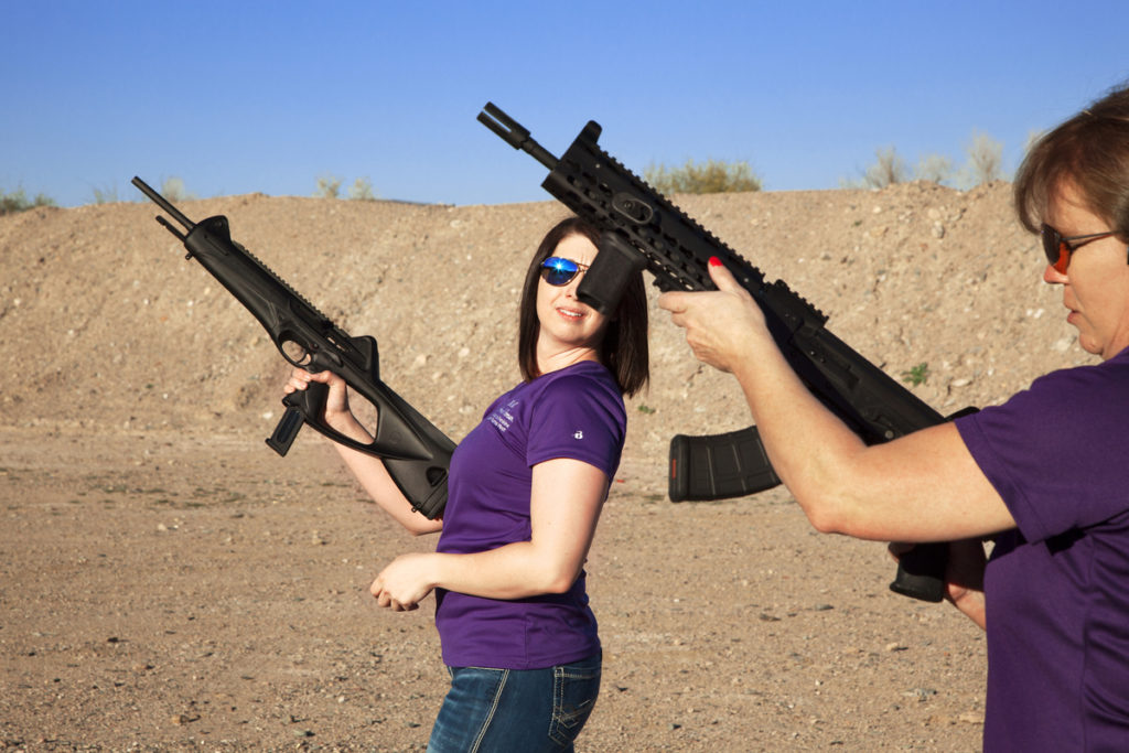 Carrie Lightfoot (R) holds a AK 47 in her hands while her colleague Nicole Goldberger (L) a Beretta C4 Storm. Peoria. Arizona, USA - 2016